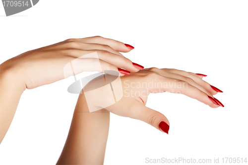 Image of woman hands with red nails