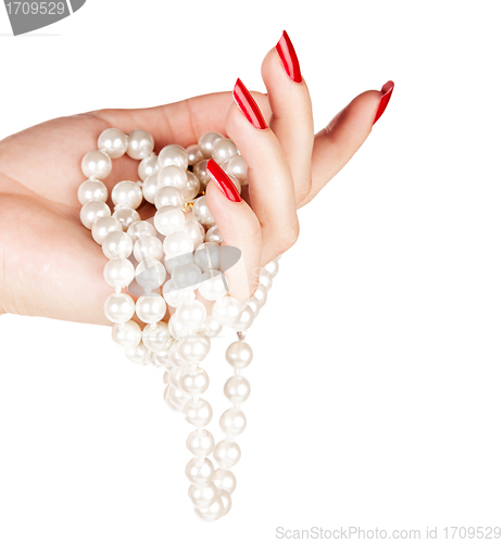 Image of hand of woman with pearls