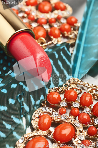 Image of coral pink lipstick close-up