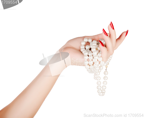 Image of hand of woman with pearls