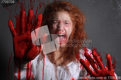 Image of Horror Themed Image With Bleeding Freightened Woman