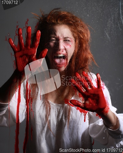 Image of Horror Themed Image With Bleeding Freightened Woman