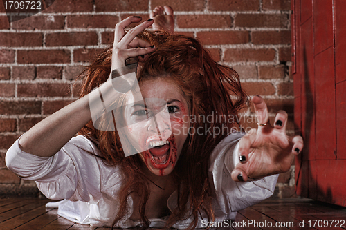 Image of Horror Themed Image With Bleeding Freightened Woman