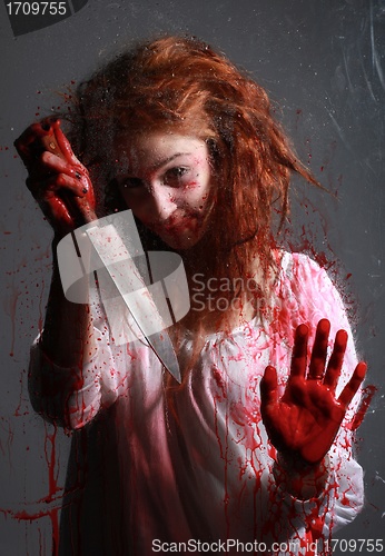 Image of Horror Themed Image With Bleeding Freightened Woman