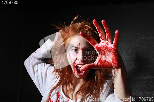 Image of Horror Themed Image With Bleeding Freightened Woman