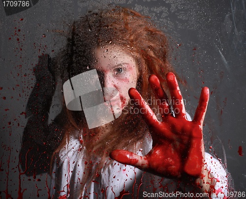 Image of Horror Themed Image With Bleeding Freightened Woman