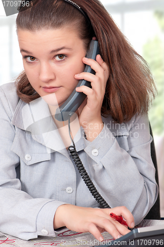 Image of Woman with newspaper