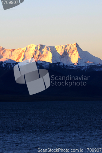 Image of Landscape of snow-capped mountains at lakeside