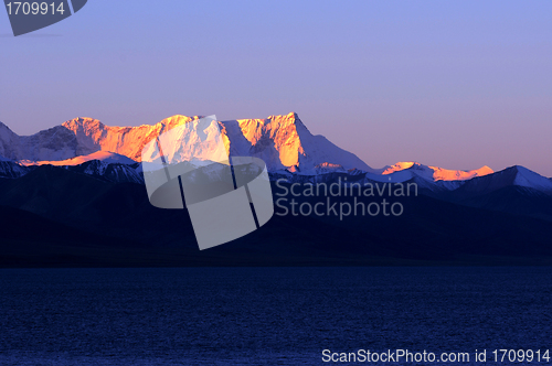 Image of Landscape of snow-capped mountains at lakeside