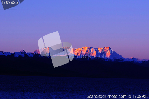 Image of Landscape of snow-capped mountains at lakeside