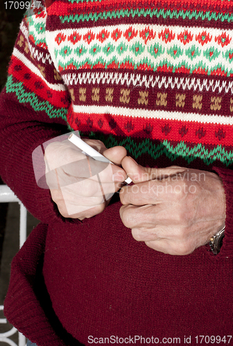 Image of cigarette in hand