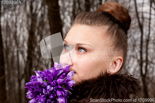 Image of girl with snowdrops