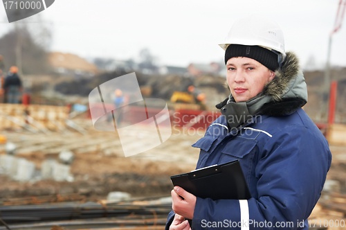 Image of builder resident engineer at construction site