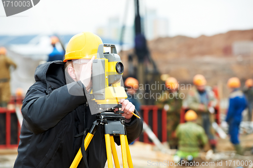 Image of surveyor works with theodolite