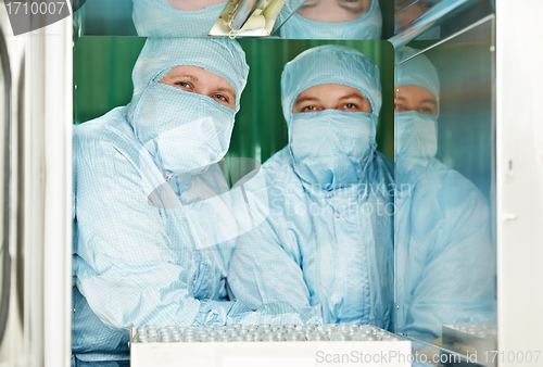 Image of Two pharmaceutical factory workers
