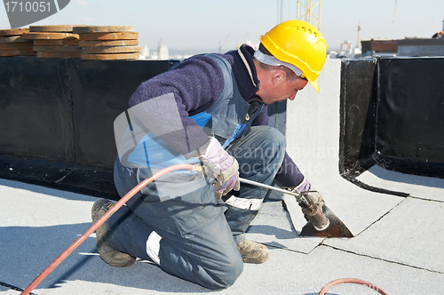 Image of Flat roof covering works with roofing felt