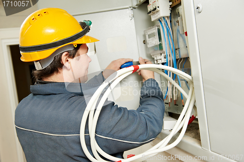 Image of Electrician installing energy saving meter