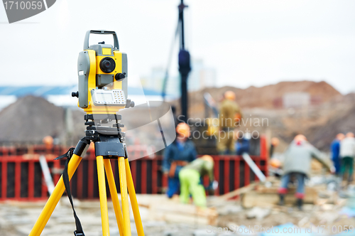 Image of surveyor equipment theodolite at construction site