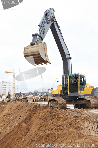 Image of track-type loader excavator at work