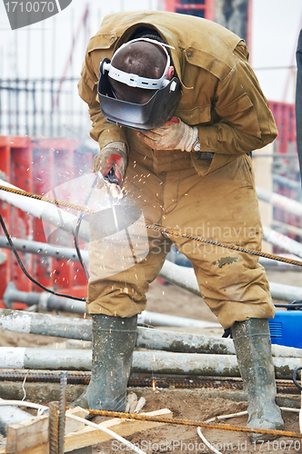 Image of builder worker wellder at work