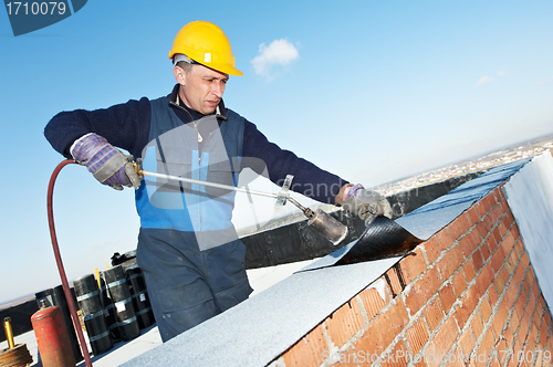 Image of Flat roof covering works with roofing felt