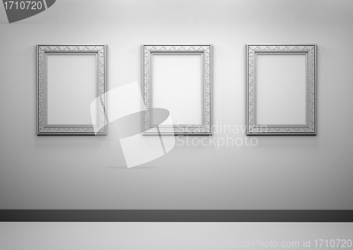 Image of Gallery Interior with empty frames on wall