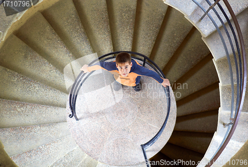 Image of young boy with mother on staircase