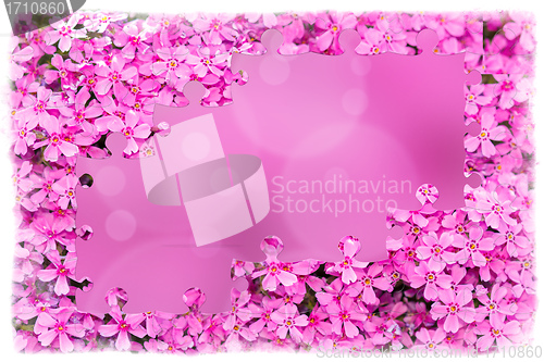 Image of pink flower frame with puzzle of flowers