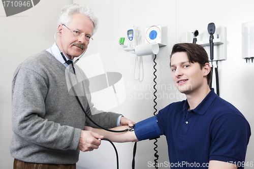 Image of Doctor Reading Pulse Rate Of a Patient