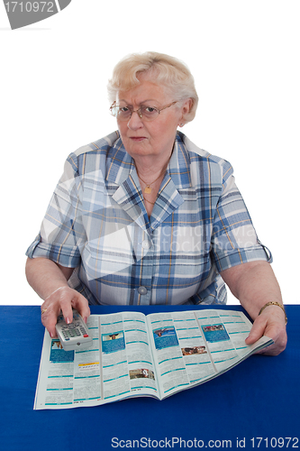 Image of Senior woman watching TV