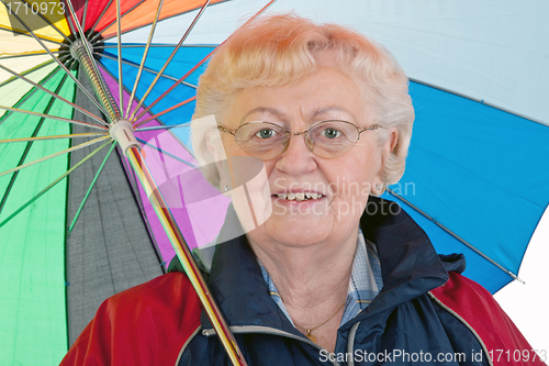 Image of Elderly woman with umbrella