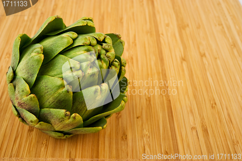 Image of Artichoke on Cutting Board