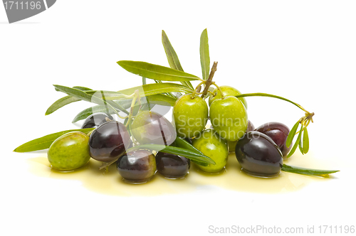 Image of variety of fresh olives with olive oil