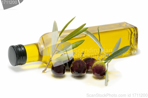 Image of bottle of olive oil and fresh olives