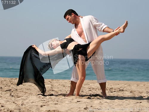 Image of Couple dancing on the beach