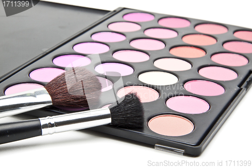 Image of Makeup brushes and make-up eye shadows