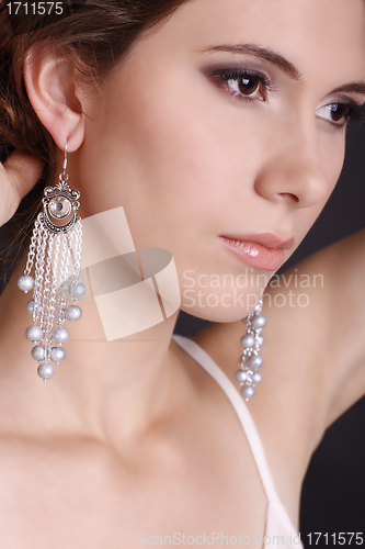 Image of beautiful elegant girl with an evening make-up wearing jewelry