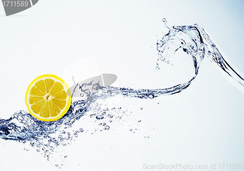 Image of lemon in spray of water