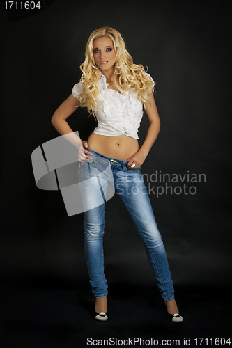 Image of Fashion photo of young sensual woman in jeans