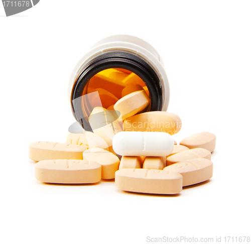 Image of Overhead view of pills in plastic pot - isolated