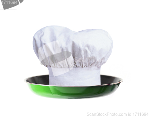 Image of A professional chefs hat on pan - concept