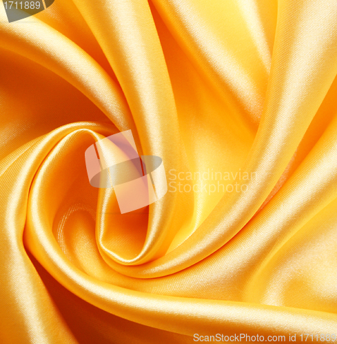 Image of Smooth elegant golden satin as background 