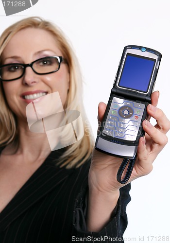 Image of Famale holding an open flip phone