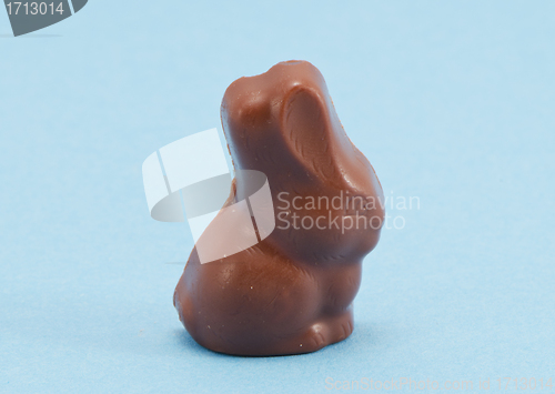 Image of Chocolate bunny Easter symbol on blue background 