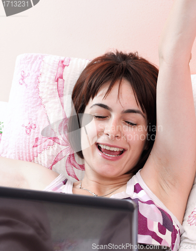 Image of Young woman with laptop 