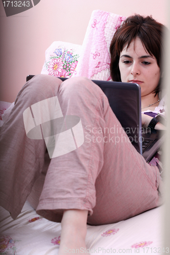 Image of Young woman with laptop 