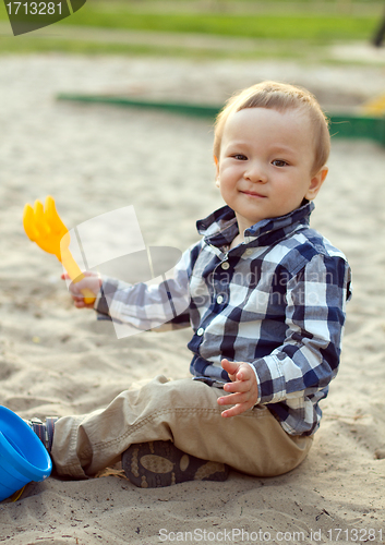 Image of Child Playing in the Sand