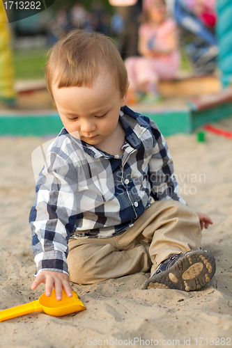 Image of Child Playing in the Sand