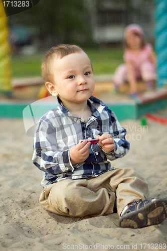 Image of Child Playing in the Sand
