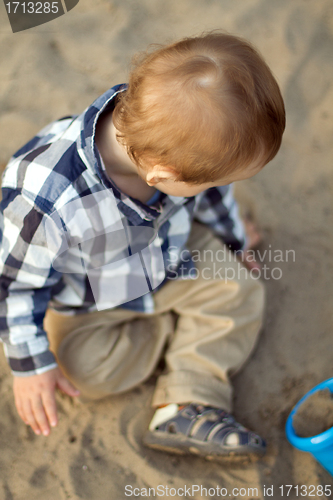 Image of Child Playing in the Sand